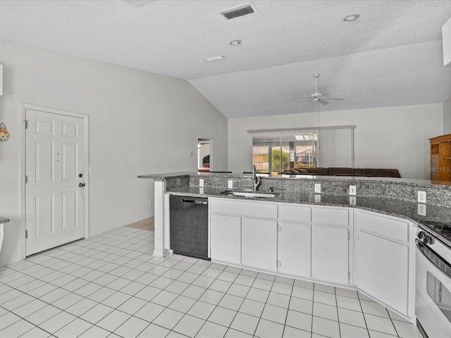 kitchen featuring lofted ceiling, white cabinets, stainless steel stove, dishwasher, and sink