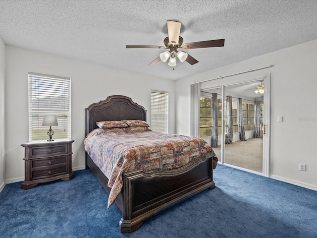 bedroom featuring a textured ceiling, carpet, and ceiling fan