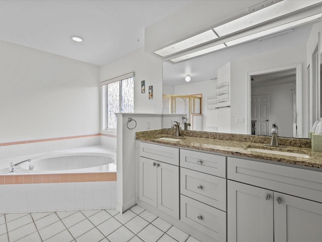 bathroom featuring vanity, shower with separate bathtub, and tile patterned floors