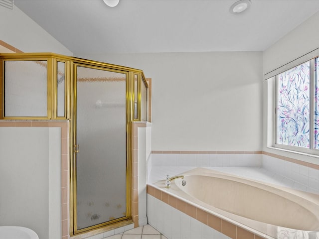 bathroom featuring tile patterned flooring and plus walk in shower