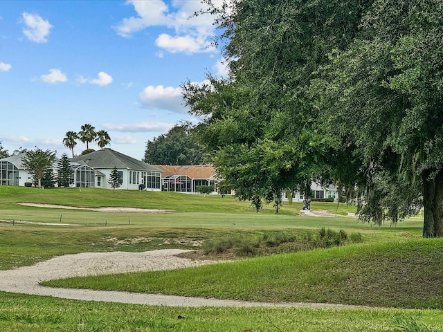 view of home's community with a lawn