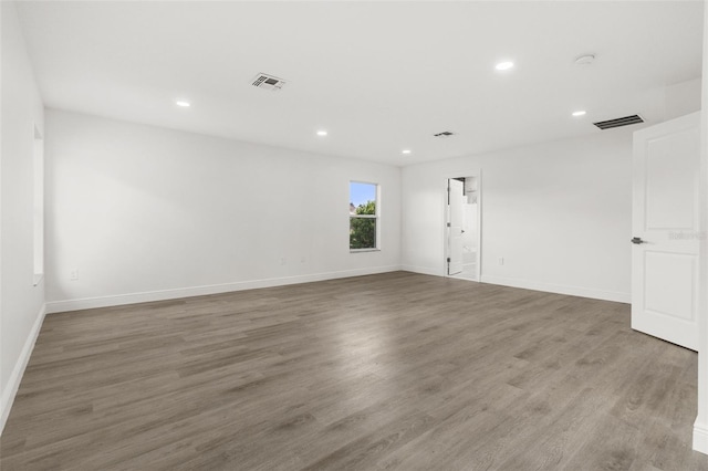 spare room featuring dark hardwood / wood-style flooring