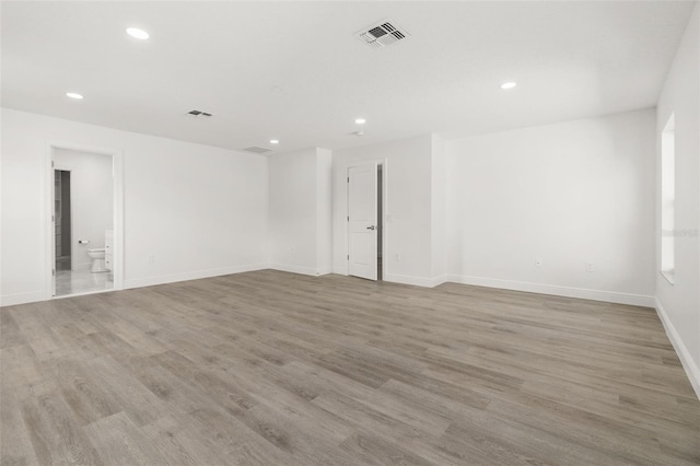 unfurnished room with light hardwood / wood-style flooring