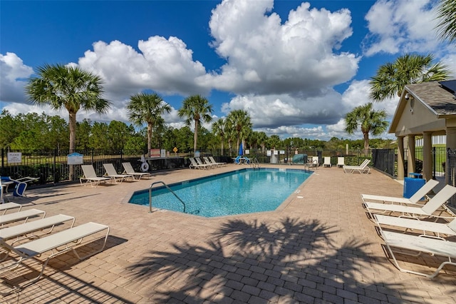 view of swimming pool with a patio