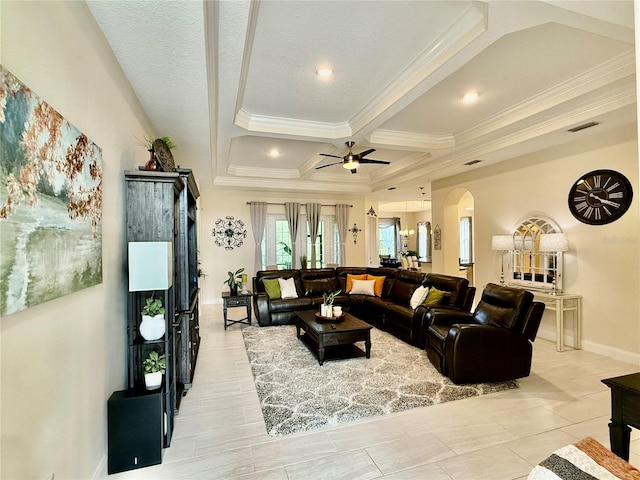 living room with ceiling fan, coffered ceiling, ornamental molding, and beamed ceiling