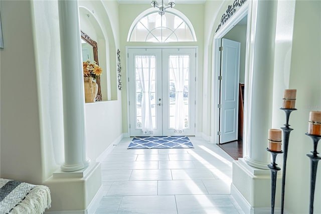 tiled entryway with french doors and decorative columns