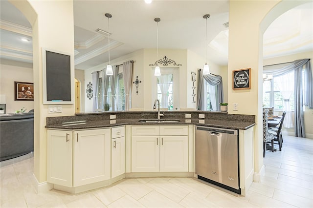 kitchen featuring dishwasher, sink, a raised ceiling, hanging light fixtures, and white cabinetry