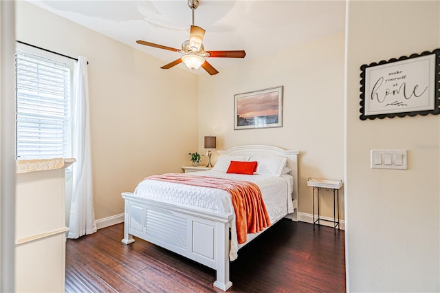 bedroom featuring dark wood-type flooring and ceiling fan