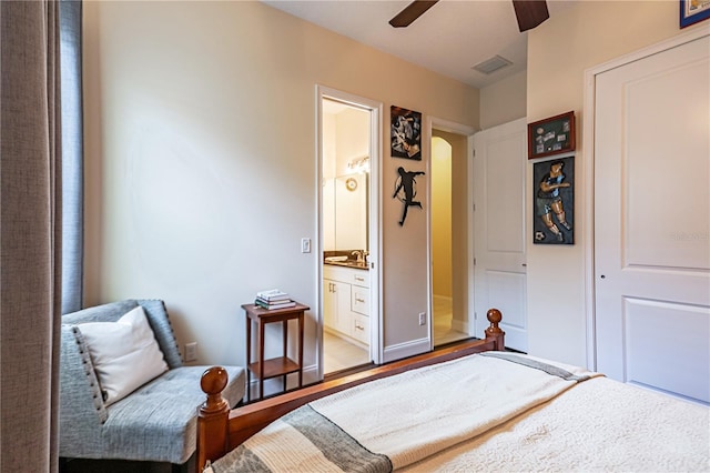 bedroom featuring ensuite bathroom, wood-type flooring, and ceiling fan