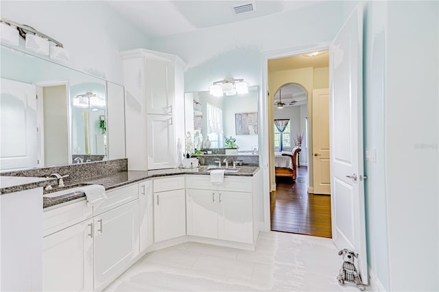 bathroom with vanity, ceiling fan, and hardwood / wood-style floors