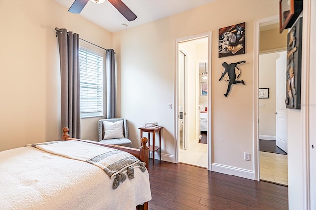 bedroom with dark wood-type flooring and ceiling fan