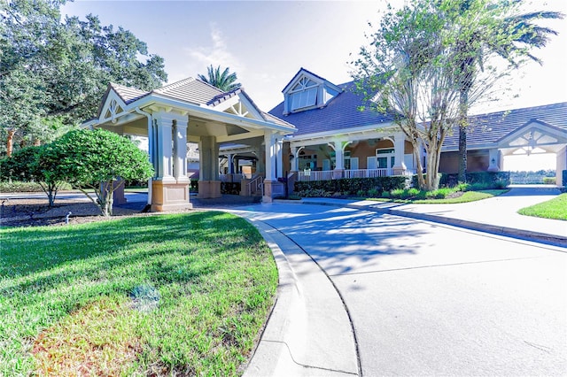 view of front of home with a front lawn and covered porch