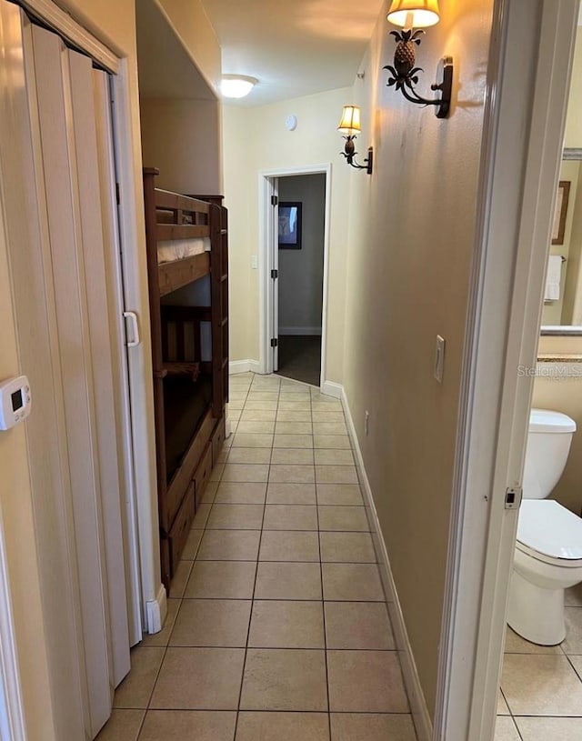 corridor with light tile patterned floors