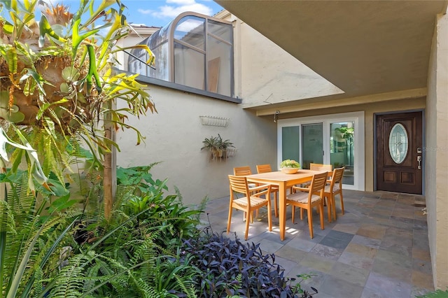 view of patio with a lanai