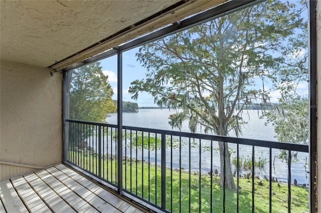 balcony featuring a water view