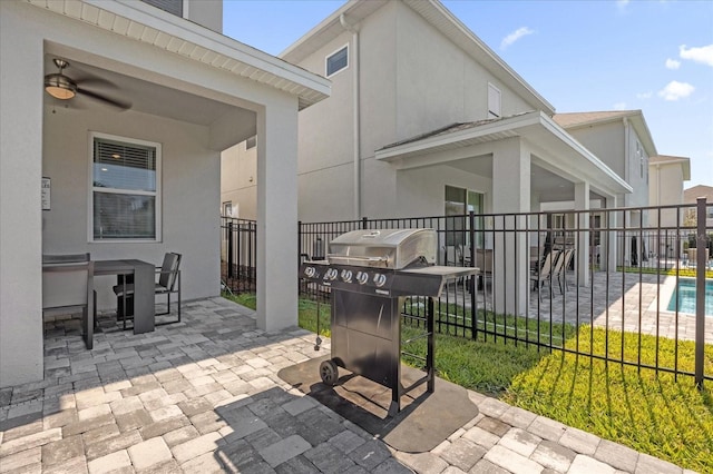 365 Southfield St, Kissimmee, FL 34747 - fenced backyard featuring area for grilling, a patio area, and ceiling fan