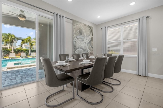 tiled dining space with ceiling fan