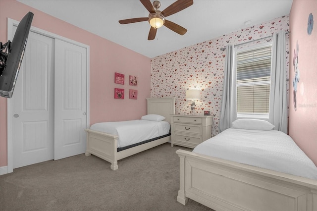 365 Southfield St, Kissimmee, FL 34747 - carpeted bedroom with a closet, ceiling fan, and wallpapered walls