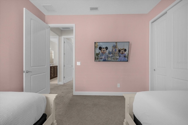 carpeted bedroom with a closet