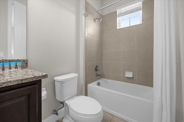 full bathroom with tile patterned flooring, vanity, toilet, and tiled shower / bath combo