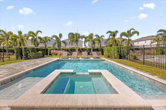 view of pool featuring an in ground hot tub