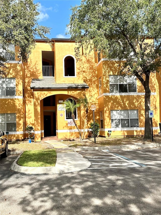 view of front of property with a balcony