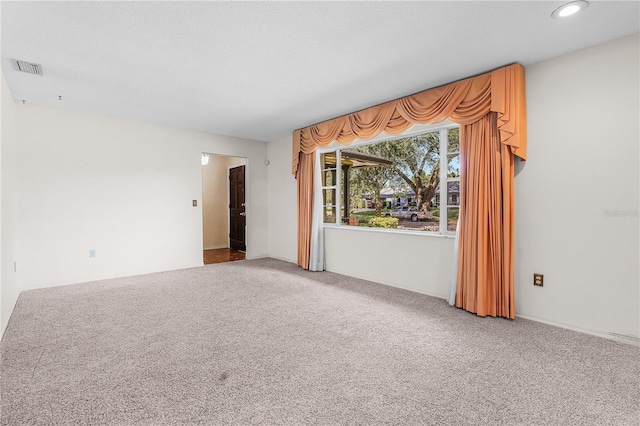 unfurnished room with carpet flooring