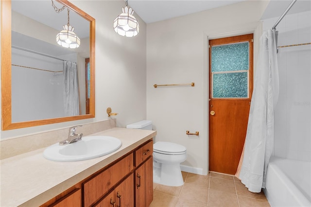 full bathroom featuring tile patterned flooring, vanity, toilet, and shower / bathtub combination with curtain