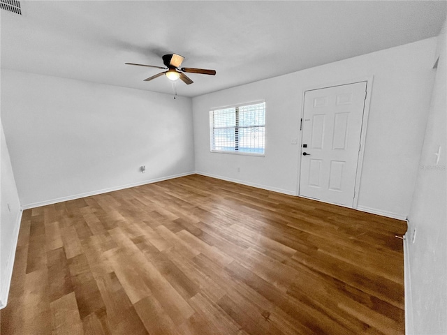 foyer with wood-type flooring and ceiling fan