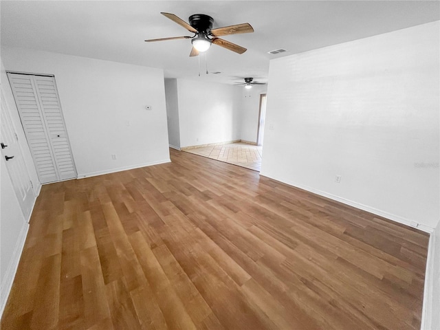 unfurnished room featuring wood-type flooring and ceiling fan