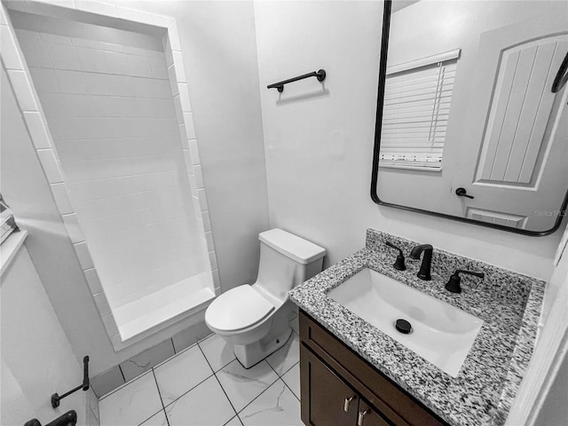 bathroom featuring vanity, toilet, and walk in shower