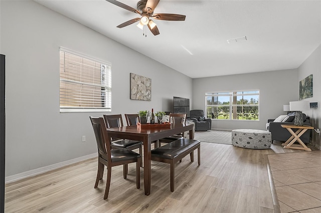 dining space featuring ceiling fan and light hardwood / wood-style flooring