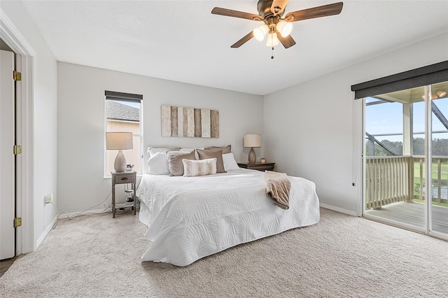 bedroom with access to exterior, ceiling fan, and carpet floors