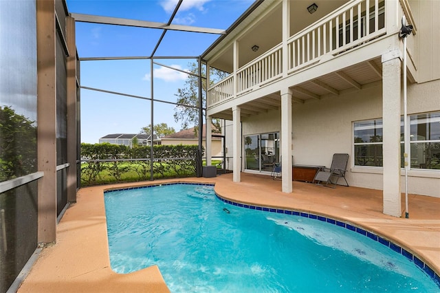 view of pool featuring a lanai and a patio