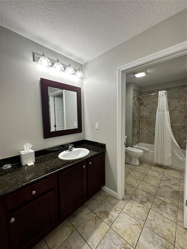 full bathroom featuring vanity, a textured ceiling, shower / tub combo with curtain, tile patterned flooring, and toilet