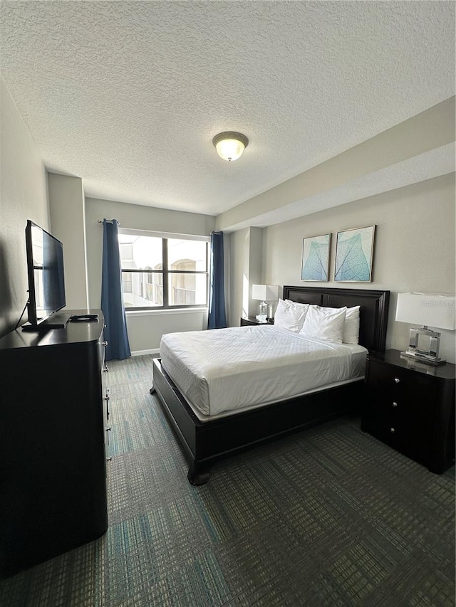 carpeted bedroom with a textured ceiling