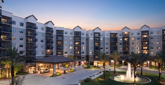 view of outdoor building at dusk