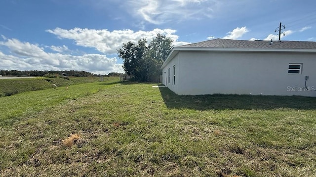 view of yard with a rural view