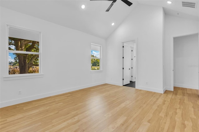 spare room with ceiling fan, light hardwood / wood-style flooring, and high vaulted ceiling