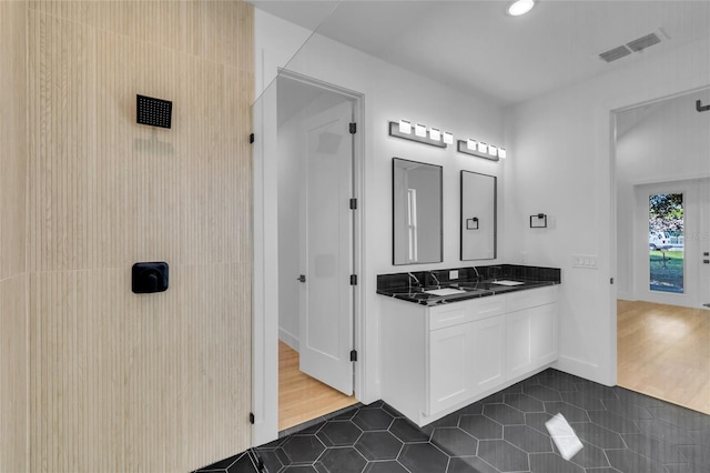 bathroom with hardwood / wood-style flooring and vanity