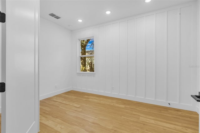 spare room featuring hardwood / wood-style floors