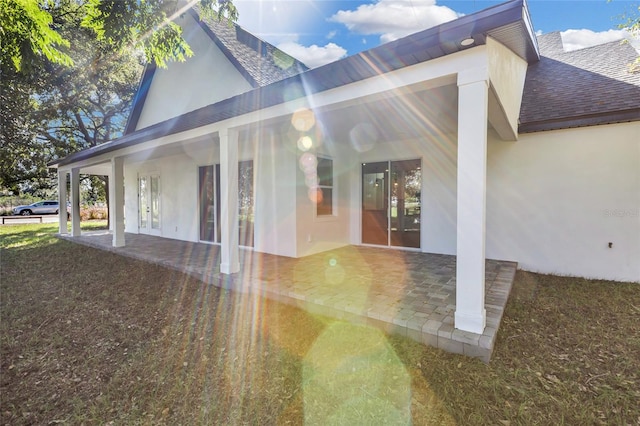 view of side of property with a patio area