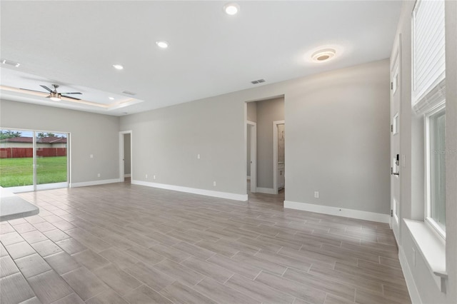 spare room featuring light hardwood / wood-style floors and ceiling fan