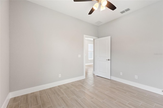 unfurnished room featuring light wood-type flooring and ceiling fan