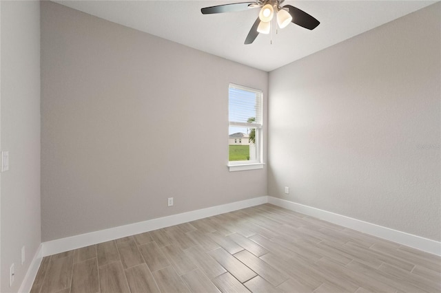 empty room with light hardwood / wood-style floors and ceiling fan