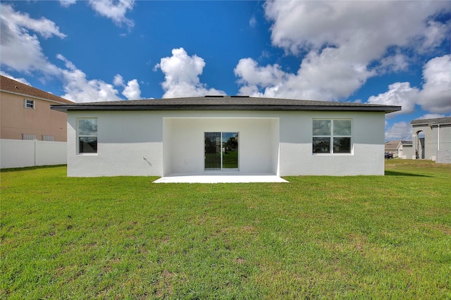 1877 Snapper Dr, Kissimmee, FL 34759 - back of house with a patio and stucco siding