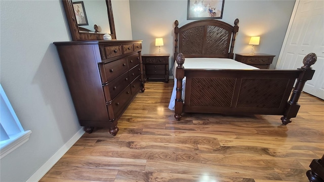 bedroom with wood-type flooring