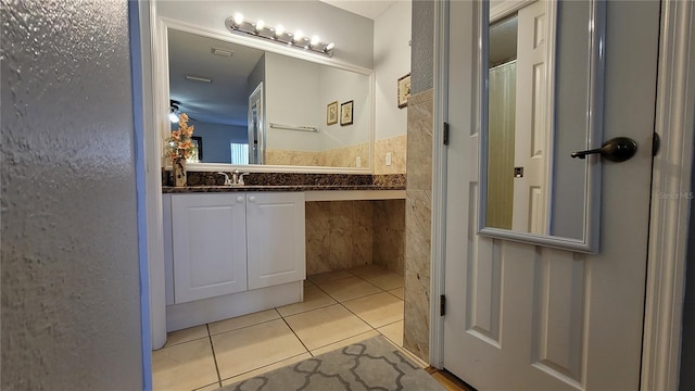 bathroom with vanity and tile patterned flooring