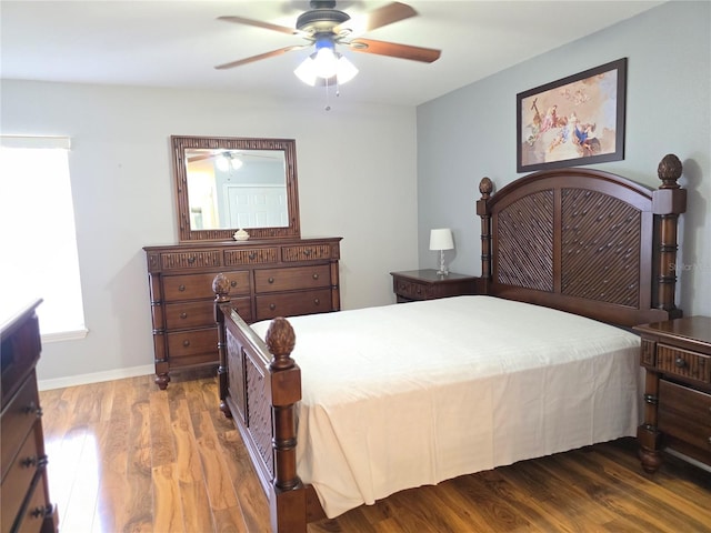 bedroom with ceiling fan and dark hardwood / wood-style floors