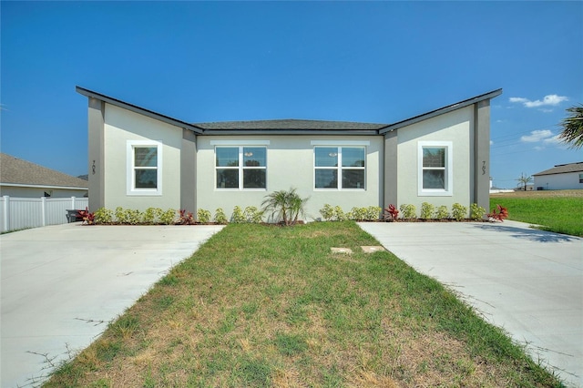 ranch-style home with a front yard